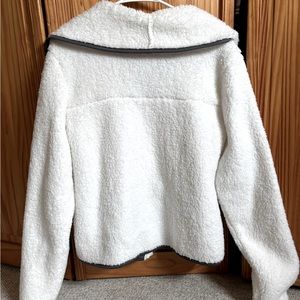 Small, white SO zip-up soft fur jacket with pockets
